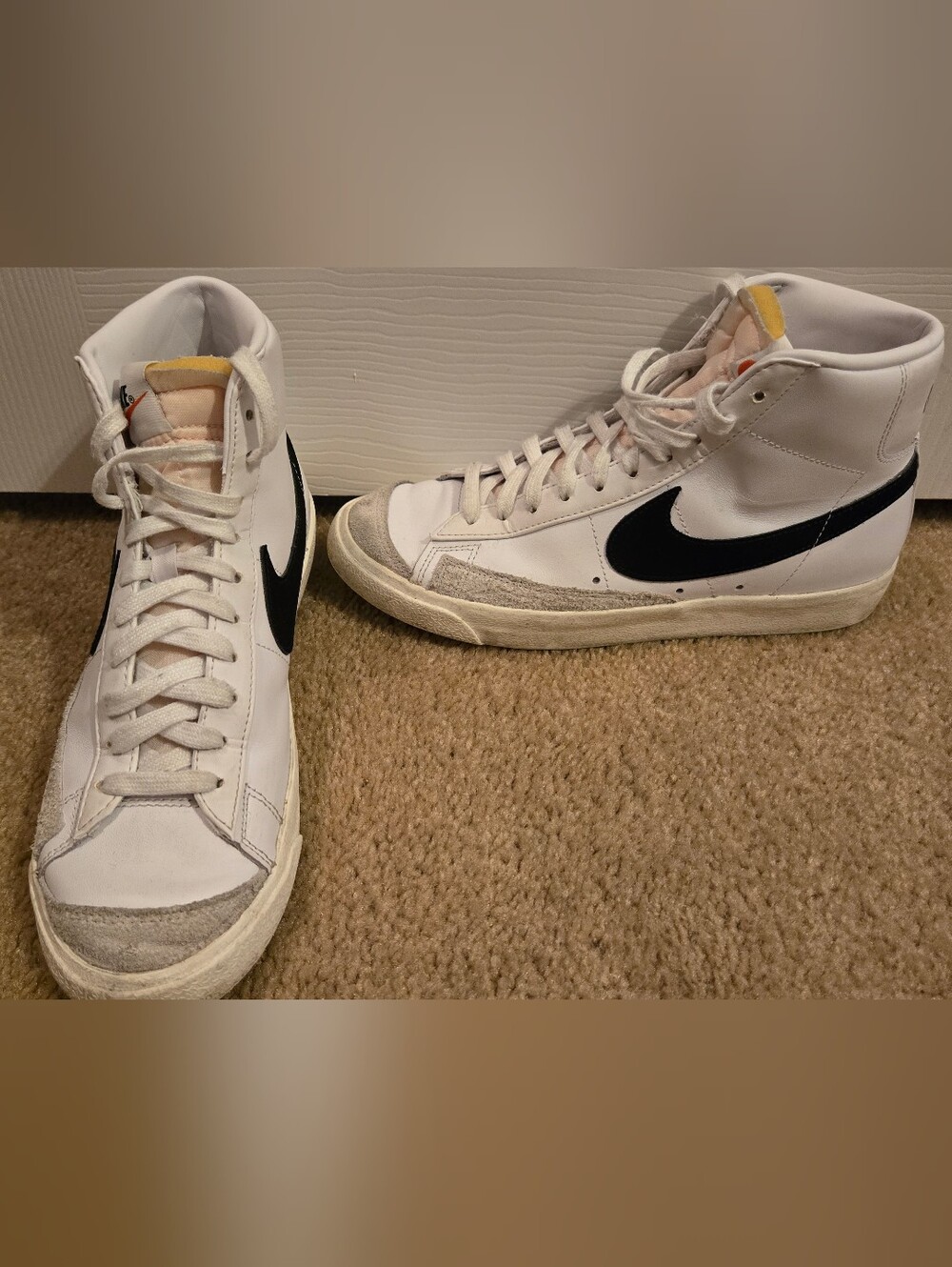 Nike White High-Top Sneakers with Black Swoosh